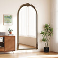 Miroir sur pied arqué